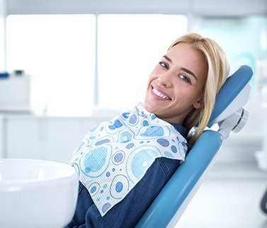 Smiling woman sitting in dental office